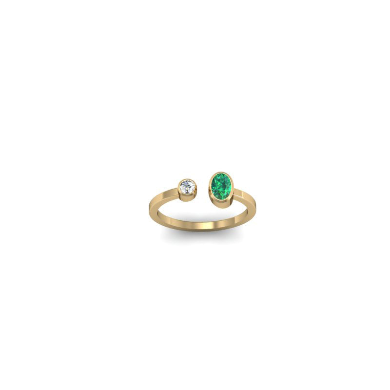 ANILLO BALANCE ESMERALDA OVALADA Y DIAMANTE REDONDO