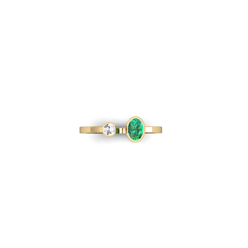 ANILLO BALANCE ESMERALDA OVALADA Y DIAMANTE REDONDO