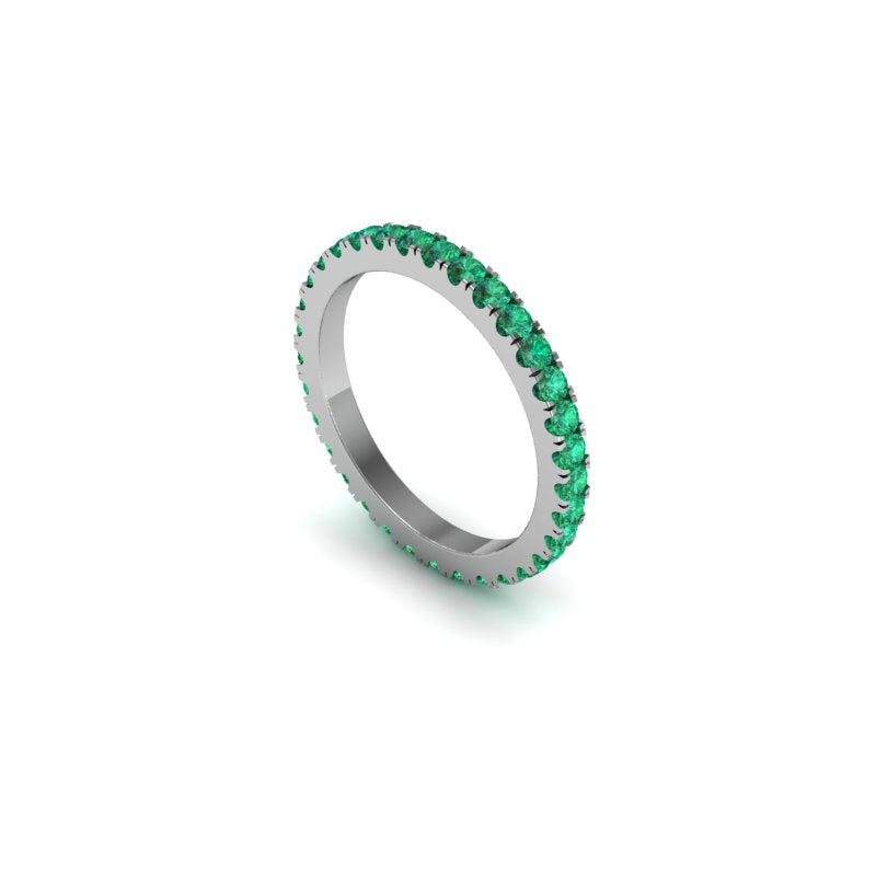 Argolla de matrimonio en oro blanco 18k con esmeraldas colombianas de 1.9 mm (0.84 ct), vista lateral izquierda, alta joyería de autor hecha a mano en Colombia.