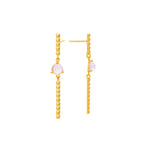 Pendientes móviles con taches y piedra luna lavanda, foto lateral. Joyería de autor, hecho en Colombia por Mariana Shuk.