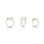 Tres tamaños de anillos piedra luna óvalo borde oro, foto con vista frontal. Joyería hecha a mano en plata y oro con piedra luna rainbow. Diseños exclusivos, hecho en Colombia por Mariana Shuk.